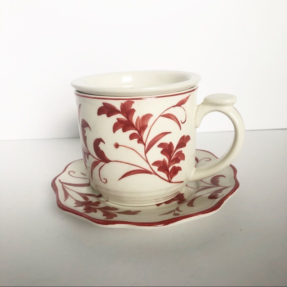 tea cup with steeping insert and matching saucer